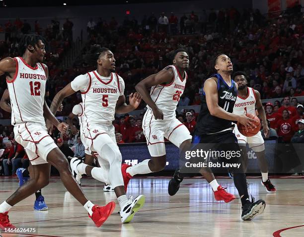 Brandon Betson of the Tulsa Golden Hurricane drives to the basket against the Houston Cougars at Fertitta Center on February 08, 2023 in Houston,...