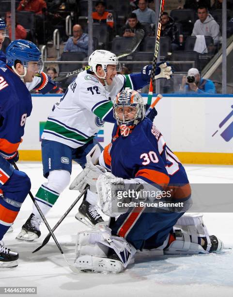 Anthony Beauvillier of the Vancouver Canucks scores a third period goal against the New York Islanders at UBS Arena on February 09, 2023 in Elmont,...