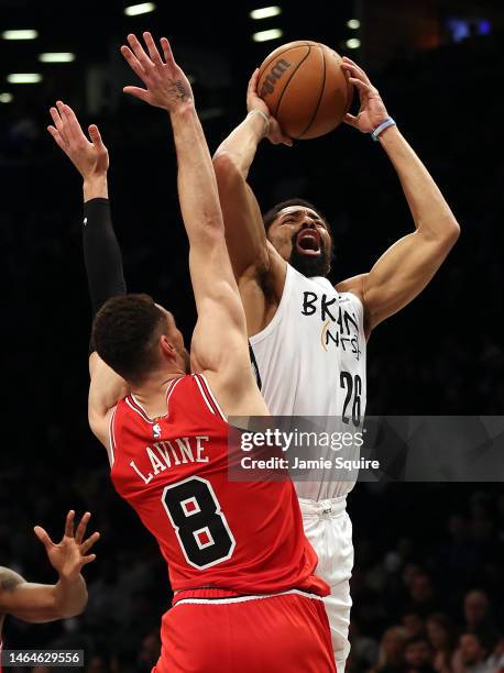 Spencer Dinwiddie of the Brooklyn Nets shoots over Zach LaVine of the Chicago Bulls during the game at Barclays Center on February 09, 2023 in New...
