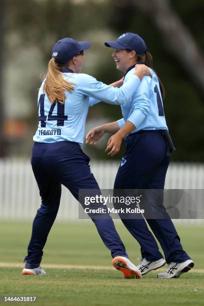 Isabella Malgioglio of the NSW Breakers celebrates with her team mate Anika Learoyd after taking the wicket of Katie Mack of the Meteors during the...