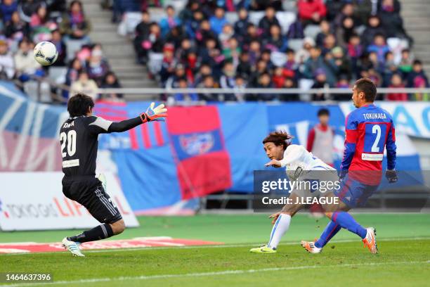 Shingo Akamine of Vegalta Sendai scores the team's first goal past Shuichi Gonda of FC Tokyoduring the J.League J1 match between FC Tokyo and Vegalta...
