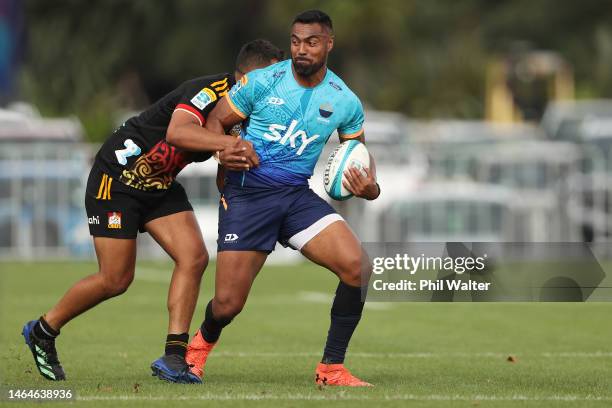 Lolagi Visinia of Moana Pasifika is tackled during the Super Rugby trial match between Moana Pasifika and Chiefs at Mt Smart Stadium on February 10,...