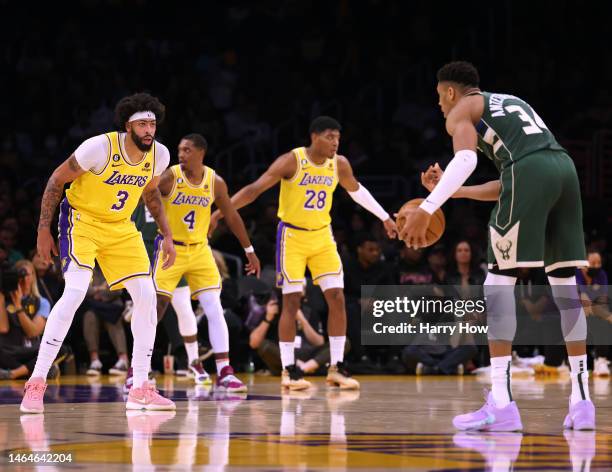 Giannis Antetokounmpo of the Milwaukee Bucks dribbles in front of Anthony Davis of the Los Angeles Lakers during the first half at Crypto.com Arena...