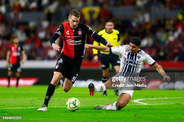 Julio Furch of Atlas fights for the ball with Luis Romo of Monterrey during the 6th round match between Atlas and Monterrey as part of the Torneo...