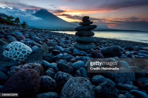 sunset at amed village - bali volcano stock pictures, royalty-free photos & images