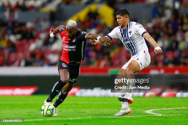 Julian Quinones of Atlas fights for the ball with Victor Guzman of Monterrey during the 6th round match between Atlas and Monterrey as part of the...