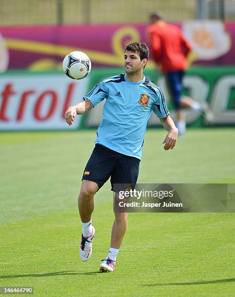 Cesc Fabregas of Spain juggles the ball during a training session ahead of their UEFA EURO 2012 group C match against Croatia on June 17, 2012 in...