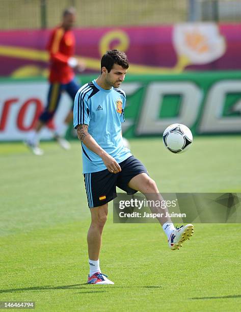 Cesc Fabregas of Spain juggles the ball during a training session ahead of their UEFA EURO 2012 group C match against Croatia on June 17, 2012 in...
