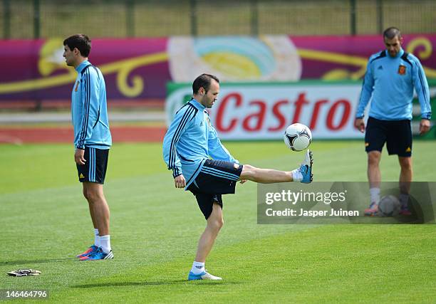 Andres Iniesta of Spain juggles the ball during a training session ahead of their UEFA EURO 2012 group C match against Croatia on June 17, 2012 in...