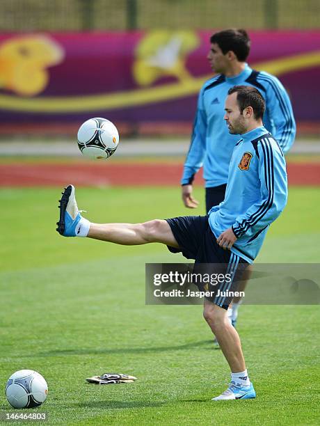 Andres Iniesta of Spain juggles the ball during a training session ahead of their UEFA EURO 2012 group C match against Croatia on June 17, 2012 in...