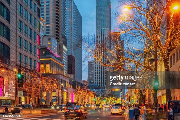 traffic and people in michigan avenue - michigan avenue stock pictures, royalty-free photos & images