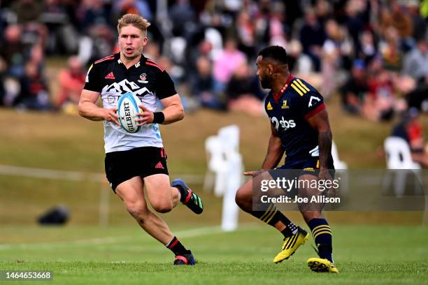 Jack Goodhue of the Crusaders charges forward during the Super Rugby trial match for the 2023 Farmlands Cup between the Crusaders and the Highlanders...