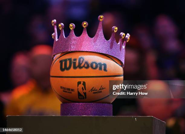 Basketball with a crown on display at half court during a ceremony honoring LeBron James of the Los Angeles Lakers as the NBA's all-time leading...