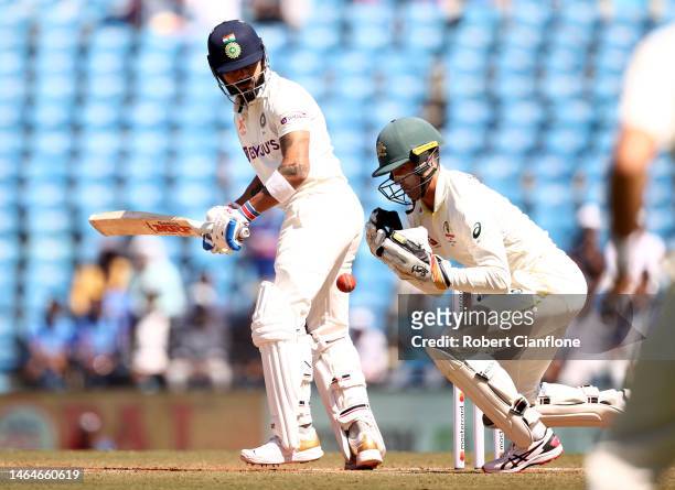 Virat Kohli of India is caught behind by Alex Carey of Australia during day two of the First Test match in the series between India and Australia at...