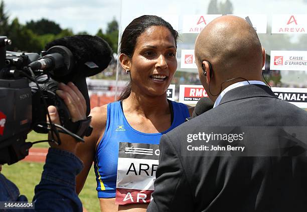 Christine Arron of France competes in the women's 100m during the 2012 French Elite Athletics Championships at the Stade du Lac de Maine on June 16,...