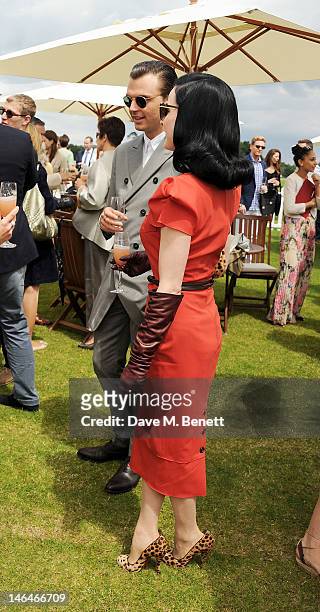 Theo Hutchcraft and Dita Von Teese attend the Cartier Queen's Cup Polo Day 2012 at Guards Polo Club on June 17, 2012 in Egham, England.