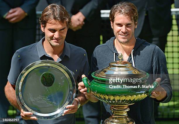 Runner-up Roger Federer of Switzerland and winner Tommy Haas of Germany pose for photographers after the final match during day seven of the Gerry...