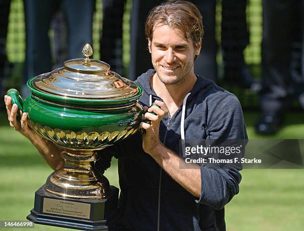 Tommy Haas of Germany celebrates his victory in the final match against Roger Federer of Switzerland during day seven of the Gerry Weber Open at...