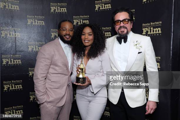 Ryan Coogler, Honoree Angela Bassett, and SBIFF Executive Director Roger Durling pose with the Montecito Award during the 38th Annual Santa Barbara...