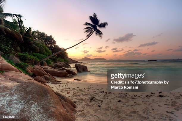 sunset at anse severe beach, seychelles - seychelles stock pictures, royalty-free photos & images