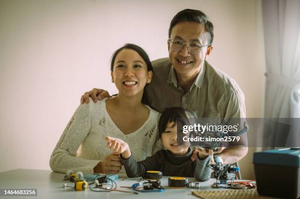 robots and family time: an asian household's living room project - school science project stock pictures, royalty-free photos & images