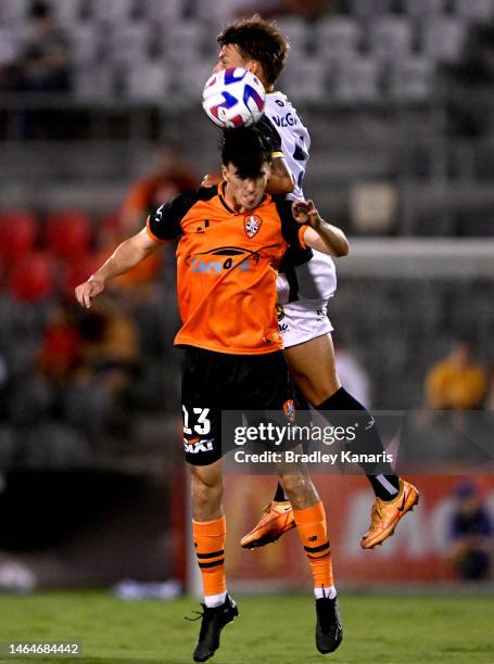 Henry Hore of the Roar and James McGarry of the Mariners challenge for the ball during the round 16 A-League Men's match between Brisbane Roar and...