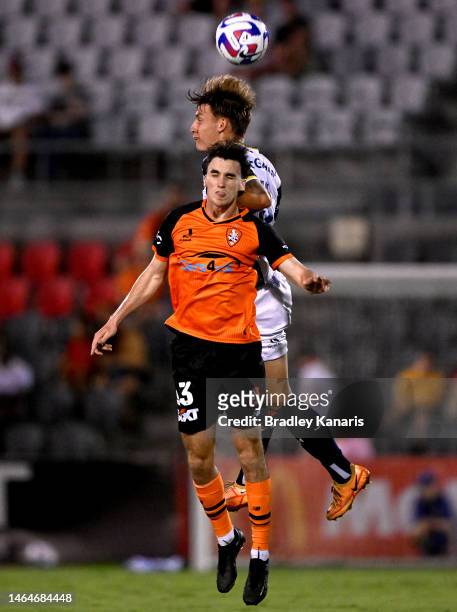 Henry Hore of the Roar and James McGarry of the Mariners challenge for the ball during the round 16 A-League Men's match between Brisbane Roar and...