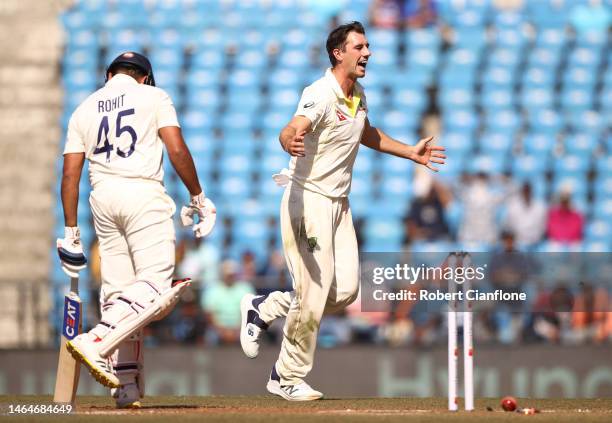 Pat Cummins of Australia celebrates taking the wicket of Rohit Sharma of India during day two of the First Test match in the series between India and...