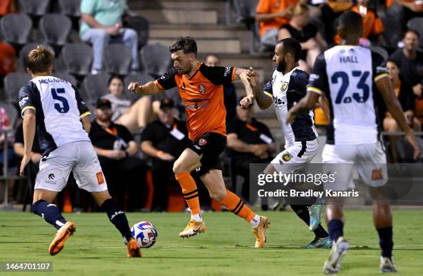 James O'Shea of the Roar takes on the defence during the round 16 A-League Men's match between Brisbane Roar and Central Coast Mariners at Moreton...