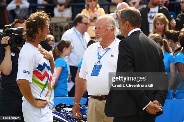 David Nalbandian of Argentina protests to ATP World Tour Supervisor Tom Barnes as tournament director Chris Kermode looks on after learning he is...