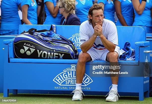 David Nalbandian of Argentina shows his dejection after learning of his disqualification for unsportsmanlike conduct during his mens singles final...