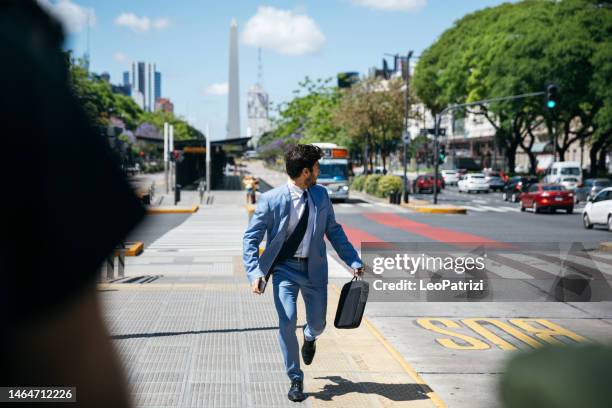 businessman missing the bus - businessman running stock pictures, royalty-free photos & images