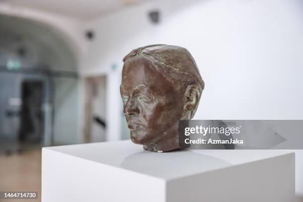 close up of a statue of a man's head in a museum - museum pedestal stock pictures, royalty-free photos & images