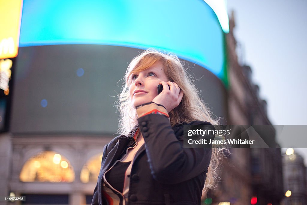 Young Woman on the Phone in the centre of the City