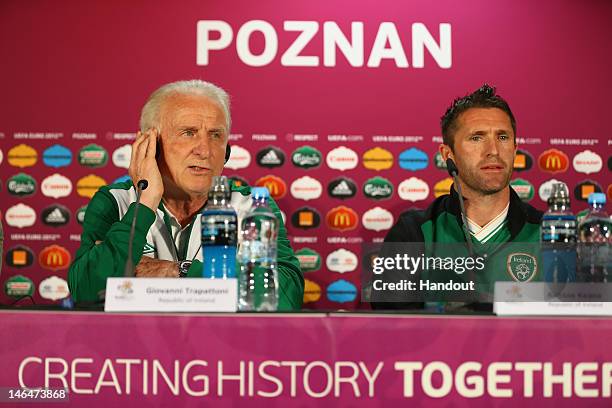 In this handout image provided by UEFA, Coach Giovanni Trapattoni and Robbie Keane of Republic of Ireland talk to the media during a UEFA EURO 2012...