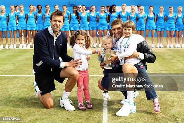 Daniel Nestor of Canada with daughter Tiana and Max Mirnyi of Belarus with son Demid and daughter Petra after winning their mens double final round...