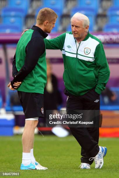 Damien Duff and head coach Giovanni Trapattoni of Ireland talk during a UEFA EURO 2012 training session at the Municipal Stadium on June 17, 2012 in...