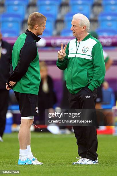 Damien Duff and head coach Giovanni Trapattoni of Ireland talk during a UEFA EURO 2012 training session at the Municipal Stadium on June 17, 2012 in...