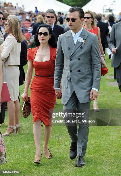 Dita Von Teese and Theo Hutchcraft attend The Cartier Queen's Cup Final at Guards Polo Club on June 17, 2012 in Egham, England.