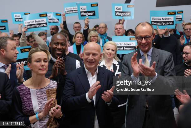 Kai Wegner , lead candidate of the German Christian Democrats in Berlin state elections, is flanked by CDU head Friedrich Merz as they attend an...