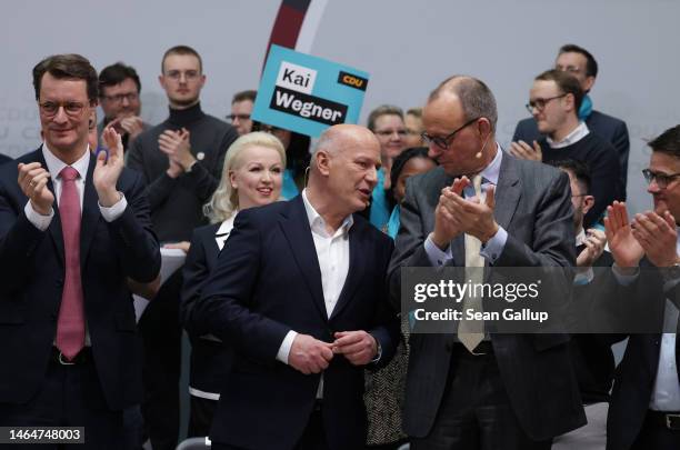 Kai Wegner , lead candidate of the German Christian Democrats in Berlin state elections, is flanked by CDU head Friedrich Merz and North...