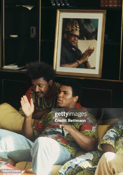 Heavyweight boxer Muhammad Ali and fight promoter Don King relax in Ali's villa ahead of his fight against champion George Foreman in Kinshasa,...