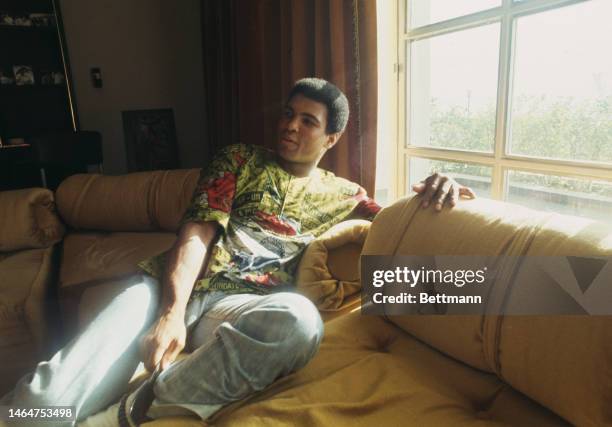 Heavyweight boxer Muhammad Ali relaxes in his villa ahead of his fight against champion George Foreman in Kinshasa, Zaire, October 26th 1974.