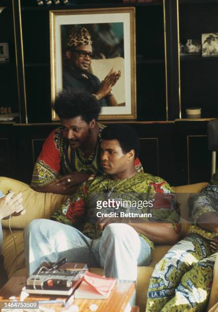 Heavyweight boxer Muhammad Ali and fight promoter Don King relax in Ali's villa ahead of his fight against champion George Foreman in Kinshasa,...