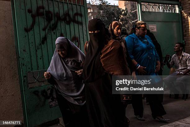 Egyptian women arrive to cast their vote at a polling station on June 17, 2012 in Cairo, Egypt. Egyptians went to the polls today, for the second...