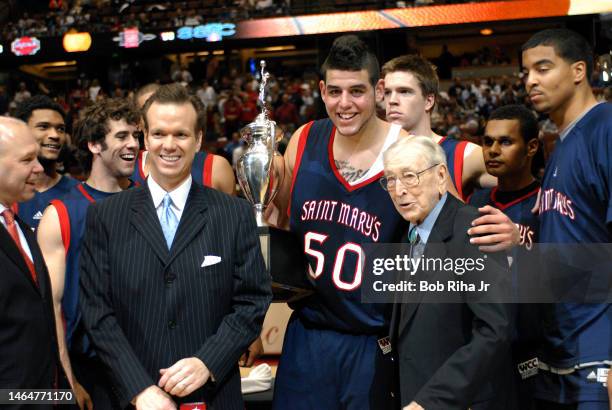 Legendary Basketball Coach John Wooden joined players from Saint Mary's College in Morgana, CA during trophy presentation celebration after winning...