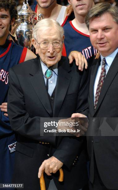 Legendary Basketball Coach John Wooden joined players from Saint Mary's College in Morgana, CA during trophy presentation after game, December 9,...