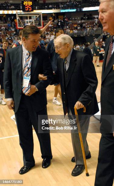 Legendary Basketball Coach John Wooden leaves the Court after joining players from Saint Mary's College in Morgana, CA during trophy presentation...