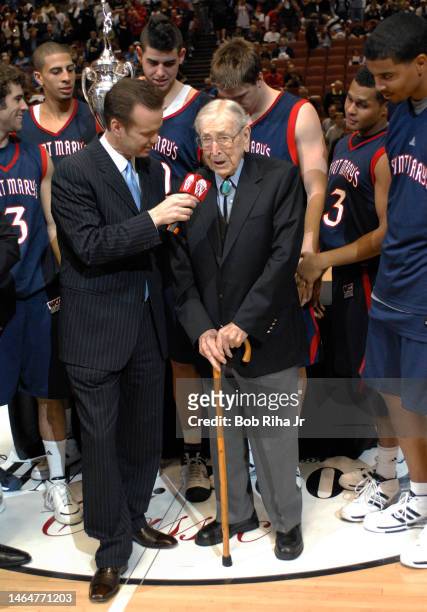 Legendary Basketball Coach John Wooden joined players from Saint Mary's College in Morgana, CA during trophy presentation celebration after winning...