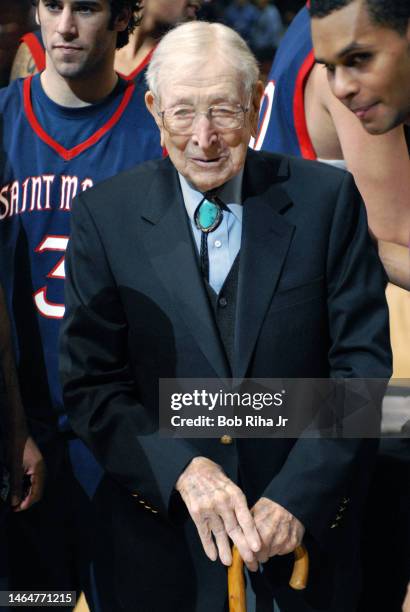 Legendary Basketball Coach John Wooden joined players from Saint Mary's College in Morgana, CA during trophy presentation celebration after winning...